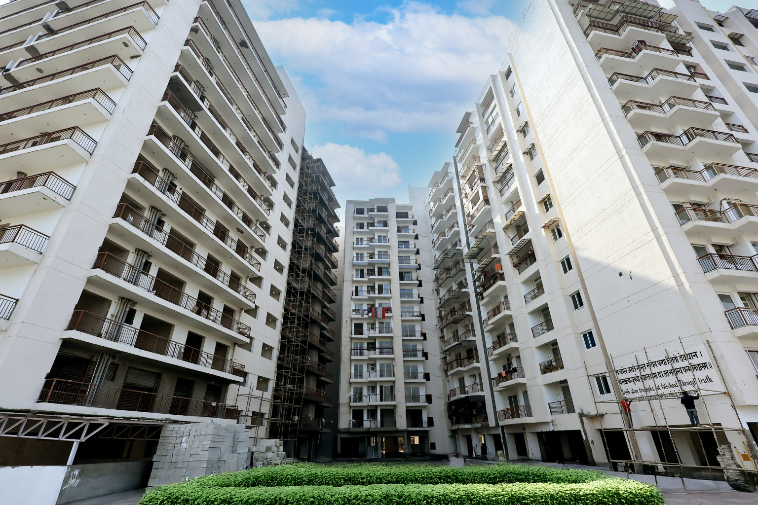 Krissh Greens apartment towers and landscaped courtyard